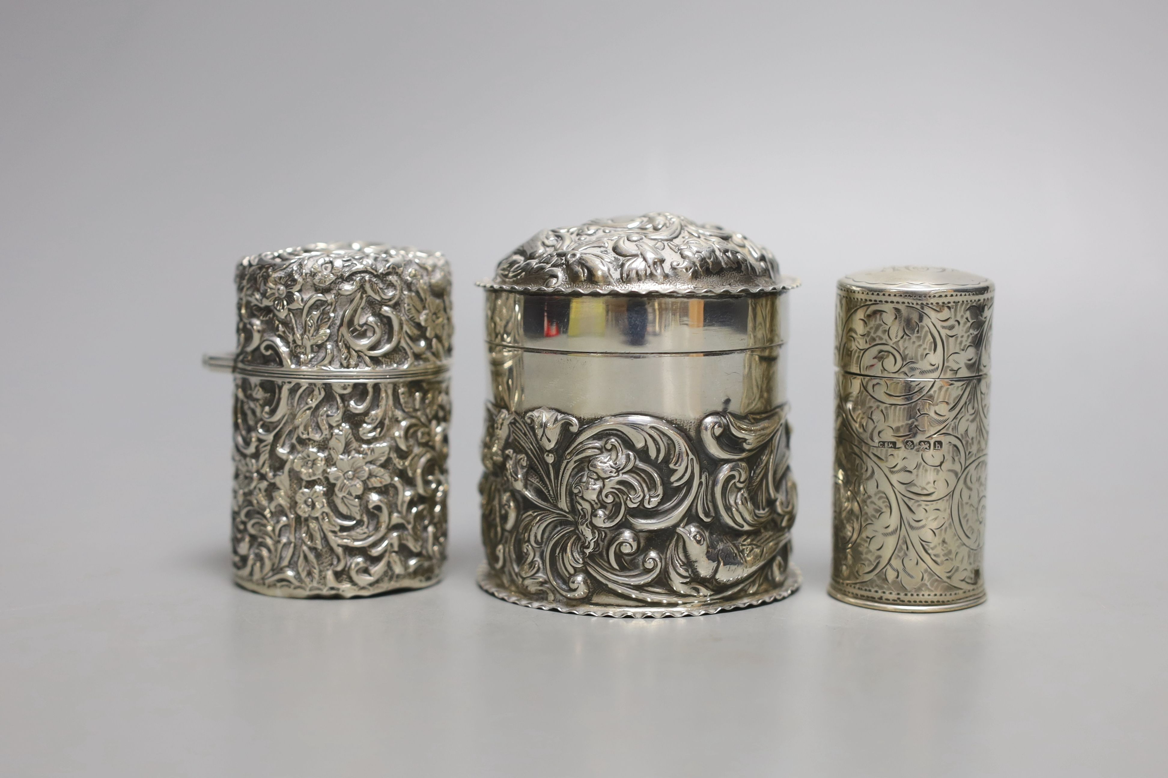 Two Edwardian silver mounted scent bottles, London, 1907, tallest 69mm and a silver embossed box and cover.